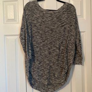 Black, white and grey sweater with cross cross cutout on back